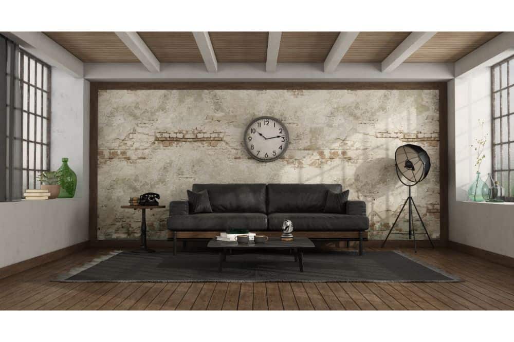 Vintage room with black sofa and wall clock