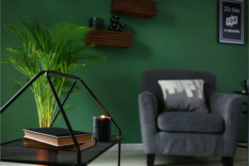Books and burning candle on table