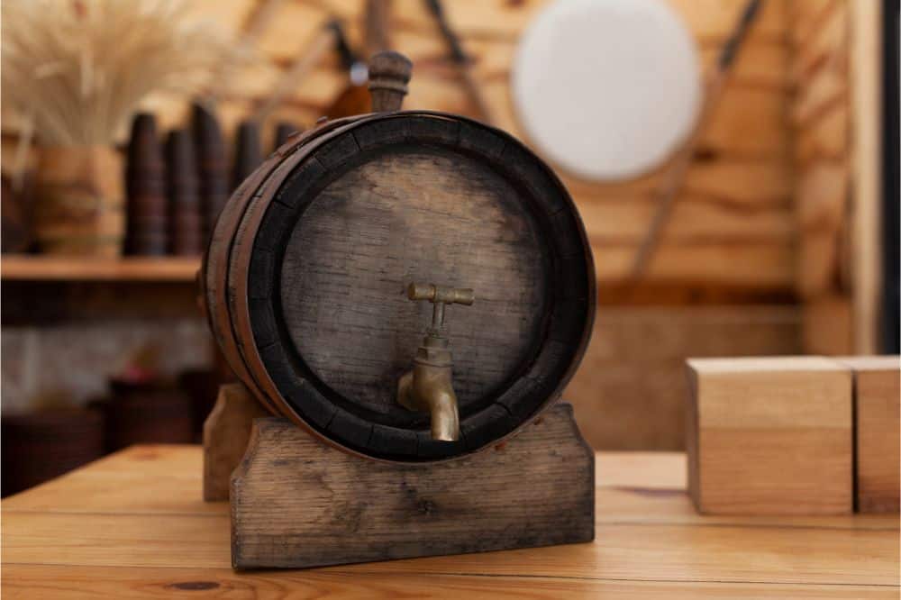 Old wooden barrel of beer with a tap on